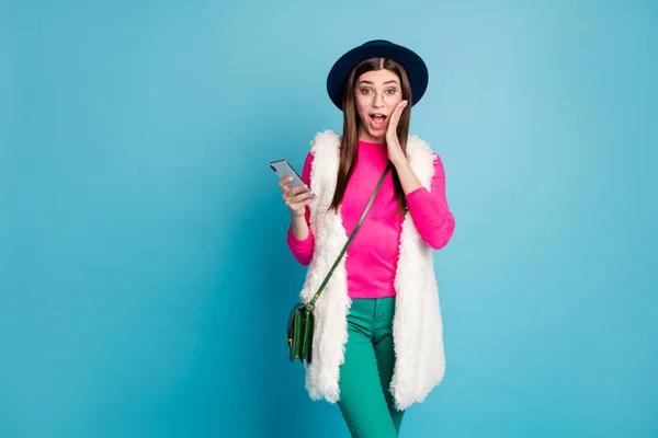 Portrait of her she nice-looking attractive lovely fashionable cheerful amazed girl using device incredible sale discount isolated on bright vivid shine vibrant green blue turquoise color background — Stock Photo, Image