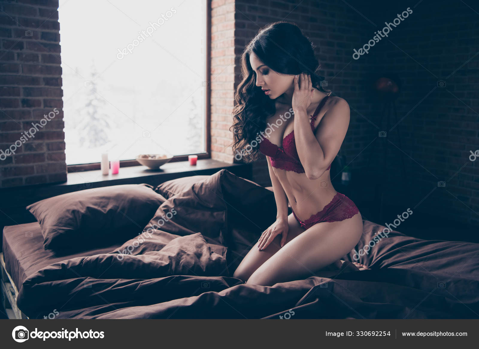 Close up side profile view photo beautiful desire she her wife surprise valentine day wait husband home hands touch herself naughty sit sheets nude romantic red lingerie room indoors bedroom Stock Photo