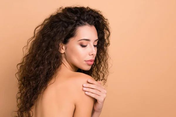 Close up side profile photo beautiful amazing she her lady smearing nourishing lotion balm wash ideal rear appearance silky skin condition slim skinny wear no clothes isolated beige pastel background — Stock Photo, Image