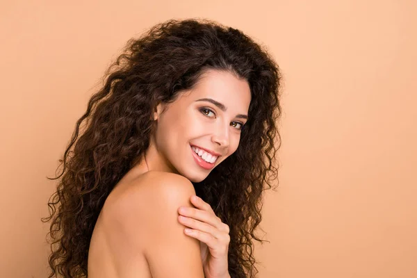 Close up side profile photo beautiful amazing she her lady hiding naked breast chest smearing lotion soft body ideal brilliant appearance toothy mouth wear no clothes isolated beige pastel background — Stock Photo, Image