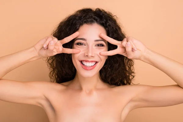 Close-up portrait of her she nice-looking attractive lovely cheerful cheery wavy-haired girl showing double v-sign near eyes party preparation disco isolated over beige background — 스톡 사진