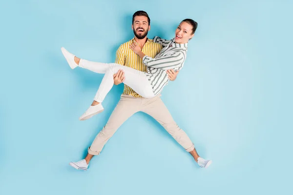 Top view above high angle flat lay flatlay lie concept full length body size view of nice cheery spouses carrying girl having fun isolated on bright vivid shine vibrant blue turquoise color background — Stock Photo, Image