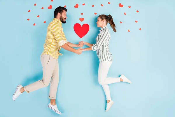Top view above high angle flat lay flatlay lie concept full length body size view of nice sweet couple holding hands isolated on bright vivid shine vibrant blue turquoise color background — 스톡 사진