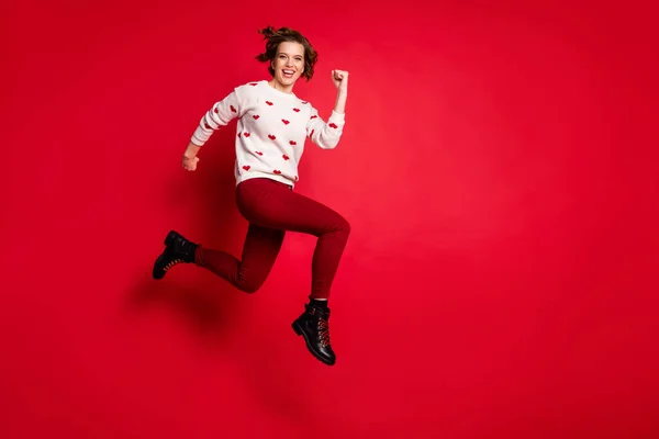 Full length body size view of nice attractive lovely cheerful cheery glad girl having fun jumping running fast late black Friday discount isolated on bright vivid shine vibrant red color background — Stock Photo, Image