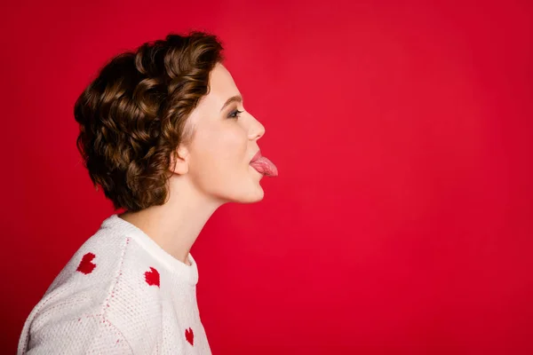 Profile side photo of positive cheerful girl enjoy 14-february celebration with her boyfriend show tongue wear stylish trendy jumper isolated over vivid color background — Stock Photo, Image