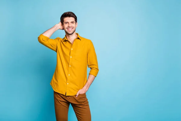 Photo of relaxing handsome man with hand in pocket enjoying his free time near empty space isolated over blue pastel color background — Stock Photo, Image