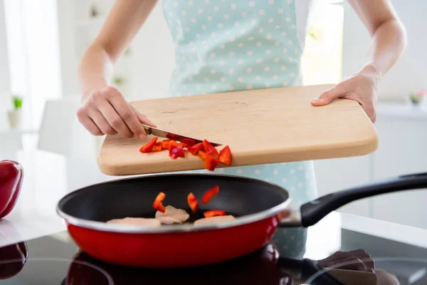 Cropped photo of housewife hands holding cutting wooden board checking meat condition adding fresh pepper cooking tasty dinner white light kitchen indoors — 스톡 사진
