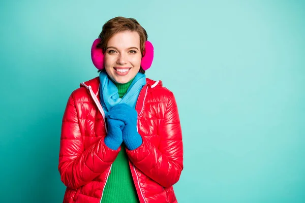 Photo of pretty traveler lady enjoy winter day buy new skaters want start skating wear stylish casual red overcoat blue scarf pink ear muffs isolated teal color background — ストック写真