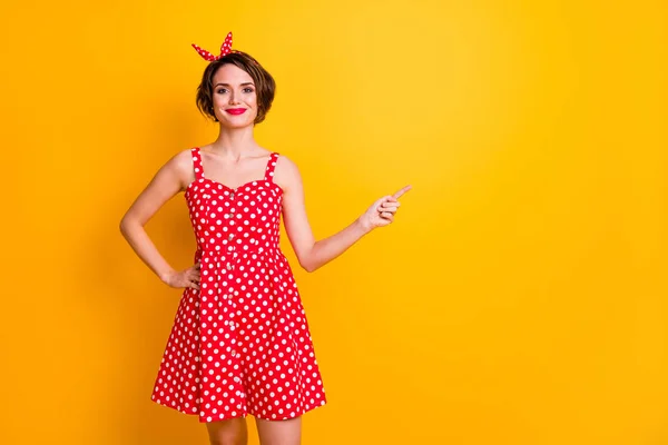 Portrait of positive cheerful girl promoter point index finger copyspace demonstrate adverts promotion wear summer retro style clothing isolated over bright color background — 스톡 사진