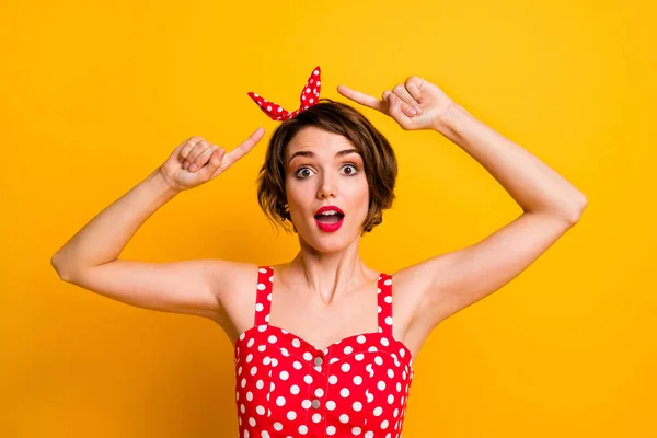 Portrait of crazy funny girl point index finger her polka-dot headband impressed scream unbelievable unexpected isolated over shine color background — 스톡 사진