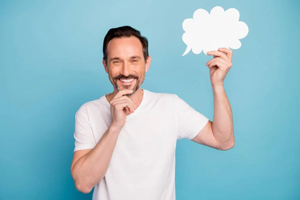 Close-up portrait of nice attractive cheerful cheery glad positive guy holding in hand empty white blank card message isolated on bright vivid shine vibrant teal green blue turquoise color background — ストック写真