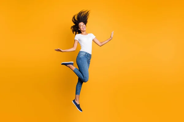 Full length body size view of her she nice attractive lovely carefree cheerful cheery girlish wavy-haired girl jumping having fun isolated over bright vivid shine vibrant yellow color background — 스톡 사진