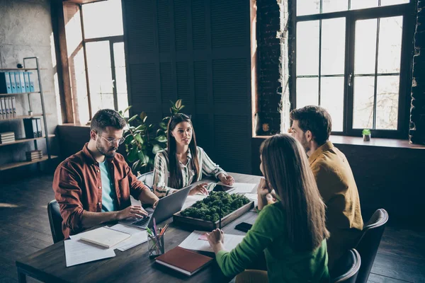 Four smart leaders entrepreneur man woman have start-up meeting gathering sit desk table tell talk say speak partnership development progress planning in workstation modern office — ストック写真