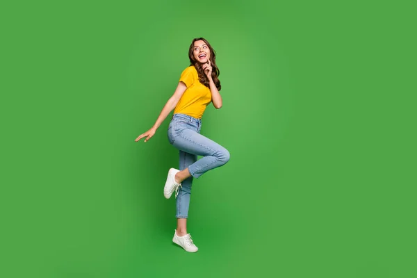 Full length body size view of her she nice attractive lovely slim fit thin curious dreamy cheerful cheery wavy-haired girl having fun isolated on bright vivid shine vibrant green color background — 스톡 사진