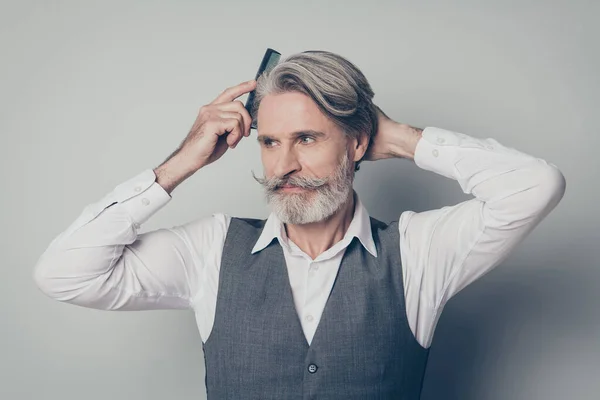 Portrait old mature man brush silky hairdo anti dander haircare hygiene groomed procedure he need preparing company owners meeting event wear vest waistcoat isolated grey color background — Stock Photo, Image