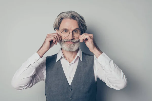 Photo of aged macho business man boss touching perfect groomed bristle mustache after salon styling wear specs office white shirt waistcoat isolated grey color background — 스톡 사진