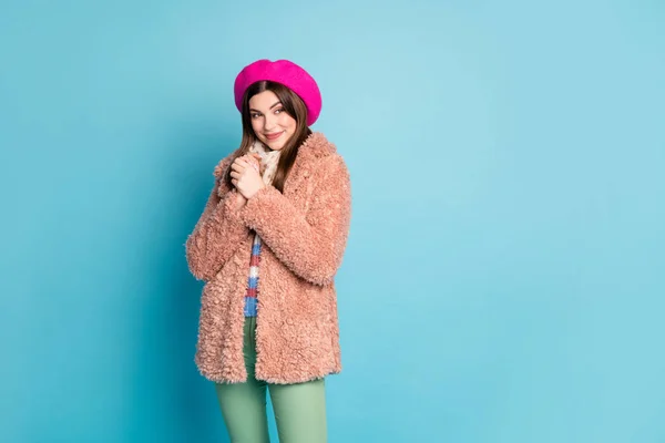 Portrait of charming cute girl fun cold winter weather walk hold hands fists look copy space feel grateful wear fur clothes green pants trousers dootted shawl isolated blue color background — 스톡 사진