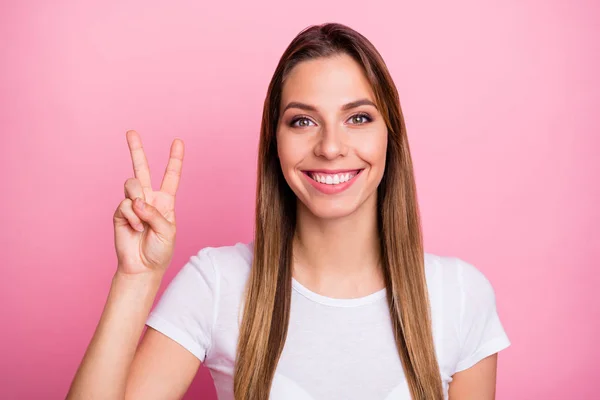 Close up photo of positive cheerful girl have spring time weekends make v-sign feel content emotions wear stylish outfit isolated over pink color background — 스톡 사진
