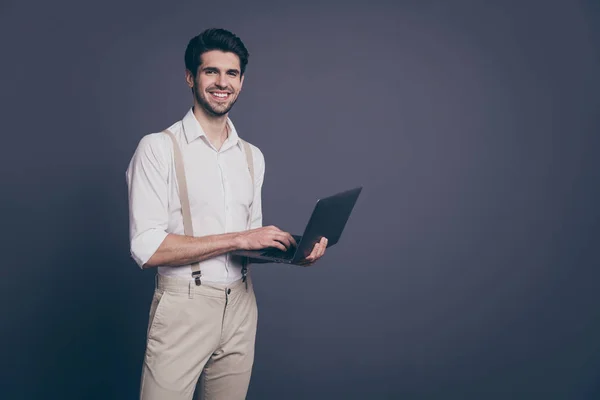 Portrait of serious man manager work on his computer send email to employees wear good looking outfit copyspace isolated over grey color background — 图库照片