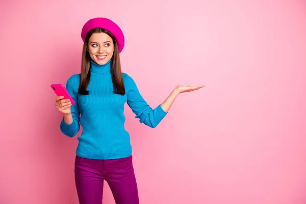 Portrait of her she nice-looking attractive lovely cute confident cheerful cheery girl holding copy space new novelty on palm advice advert isolated over pink pastel color background — 스톡 사진