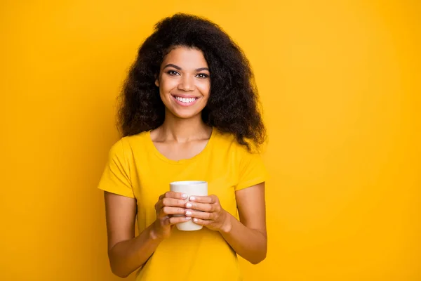Close-up portrait of nice attractive lovely pretty charming cute lovable cheerful cheery wavy-haired girl drinking latte isolated on bright vivid shine vibrant yellow color background — 스톡 사진