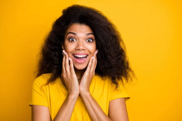 Close-up portrait of nice attractive lovely cheerful cheery amazed delighted wavy-haired girl got good news isolated on bright vivid shine vibrant yellow color background — Stockfoto