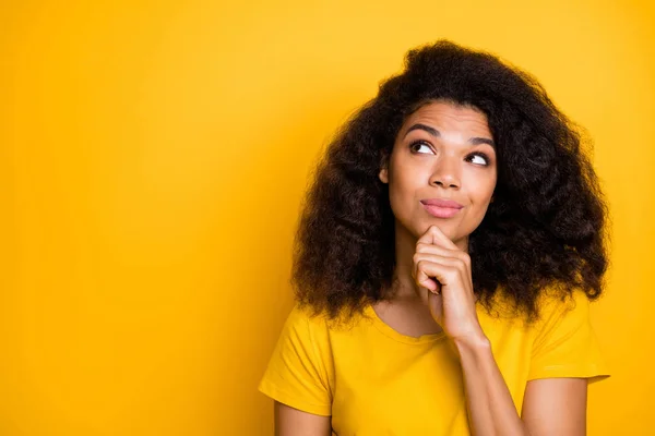 Close-up portrait of her she nice attractive lovely curious brainy creative cheerful cheery wavy-haired girl thinking touching chin isolated over bright vivid shine vibrant yellow color background — 스톡 사진