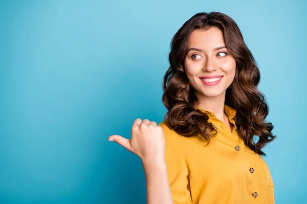 Close-up portrait of her she nice attractive charming confident cheerful cheery wavy-haired girl showing thumb aside ad isolated over bright vivid shine vibrant green blue turquoise color background — Stockfoto