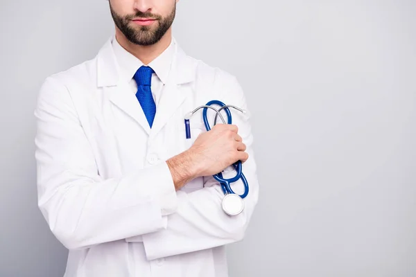 Cropped close-up view portrait of his he nice attractive focused doc surgeon holding in hand tool equipment isolated on light white gray pastel color background — 스톡 사진