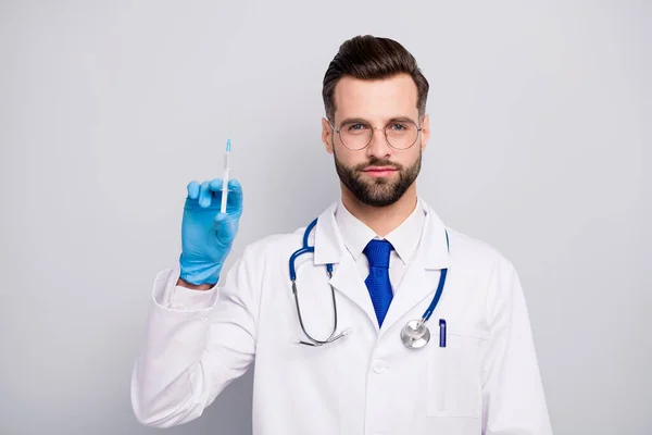 Close-up portrait of his he nice attractive smart clever qualified bearded doc expert preparing prick before surgery center isolated on light white gray pastel color background — 스톡 사진