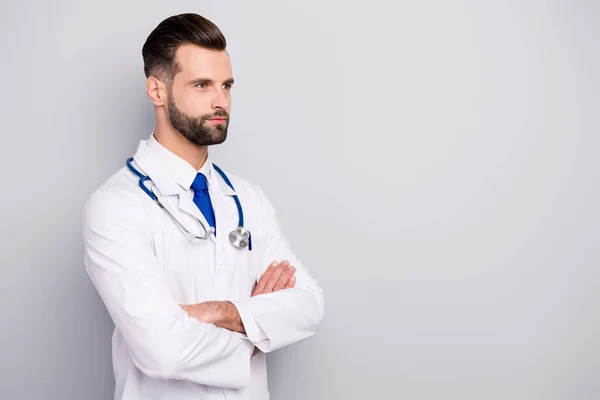 Profile side view portrait of his he nice attractive qualified skilled calm content virile masculine bearded guy doc expert folded arms isolated over light white gray pastel color background — 스톡 사진