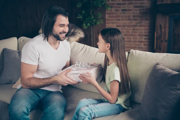 This is for me. Photo of little adorable funny lady and her handsome young daddy sit cozy sofa giving large giftbox birthday present celebrating domestic room indoors — Stock Photo, Image