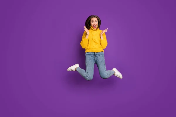 Full length body size photo of ecstatic overjoyed woman in jeans denim unable to believe in sales starting tomorrow in white foot wear expressing emotions isolated bright color background purple — 스톡 사진