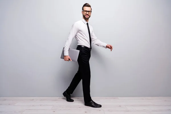 Full size profile side of confident cool entrepreneur man go walk partnership briefing hold computer isolated over white grey color background — Stock Photo, Image