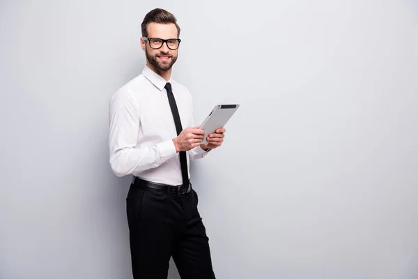 Portrait of confident cool leader man boss success freelancer use tablet enjoy decide start-up decisions wear black pants formalwear clothes isolated over grey color background