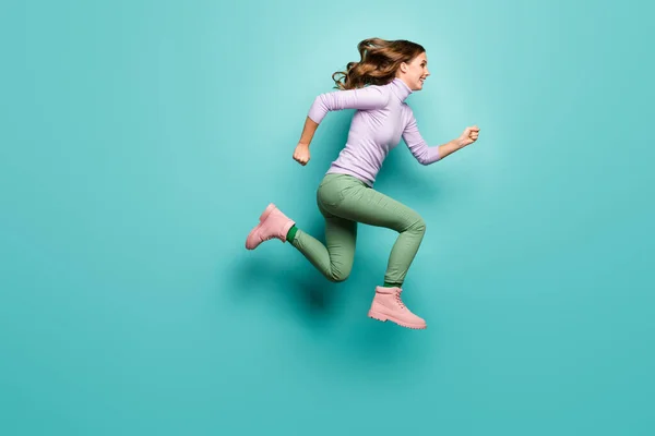 Full length profile photo of crazy excited pretty lady jump high up speed rushing black friday shopping center wear purple jumper green pants shoes isolated teal pastel color background — Stock Photo, Image