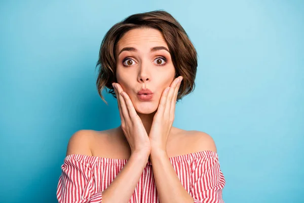 Closeup photo of attractive shocked lady open mouth arms on cheeks not believe eyes good news wear striped white red blouse open shoulders isolated blue color background — Stok fotoğraf