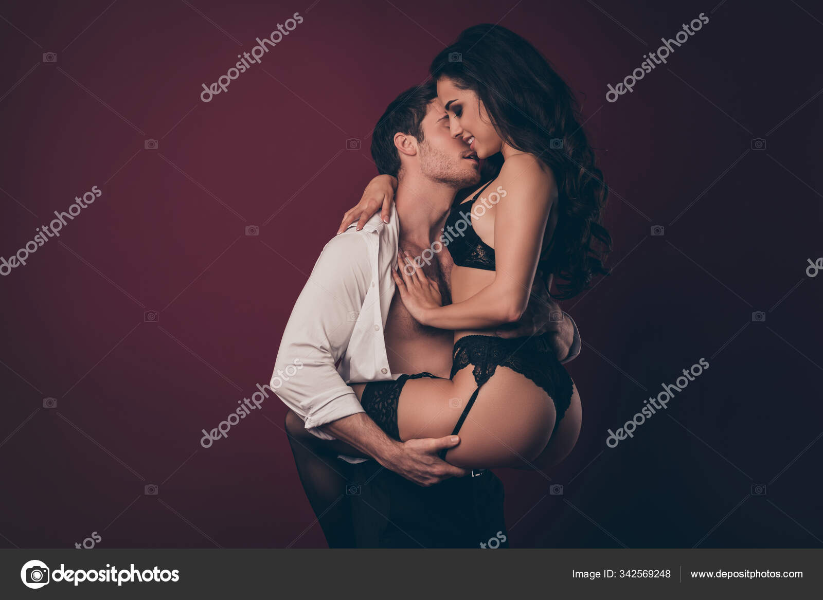 Profile photo of two horny people handsome husband hold hands ass raise nude hot black boudoir wife dream perfect body strong arms isolated burgundy color background Stock Photo by ©deagreez1 342569248 photo