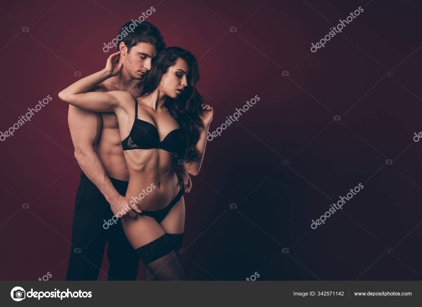 Photo of two seduce people handsome husband taking off panties nude hot black boudoir wife dream perfect body shirtless topless tights isolated maroon color background Stock Photo by ©deagreez1 342571142