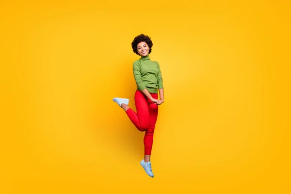Full length body size view of her she nice attractive lovely pretty cute cheerful cheery modest wavy-haired girl jumping having fun isolated over bright vivid shine vibrant yellow color background — 图库照片