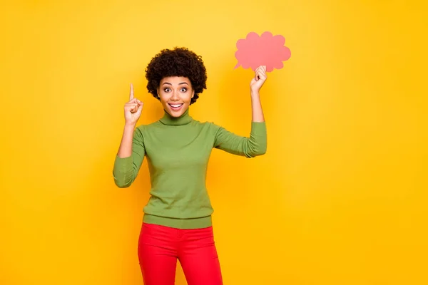 Photo of cheerful positive cute pretty sweet woman with forefinger up in red pants expressing emotions on face isolated vivid color background — Stock Photo, Image