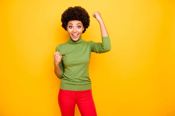 Photo of cheerful trendy charming cute girl rejoicing in winning lottery in red trousers sales discount isolated vivid color background — Stok fotoğraf