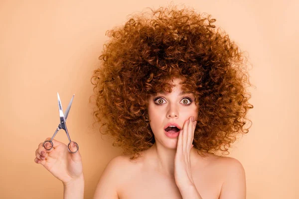 Close-up portrait of her she nice cute charming lovely attractive confused frustrated wavy-haired girl choosing solution comb scissors pampering body bodycare isolated over beige pastel background — Stock Photo, Image