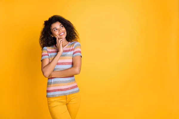 Portrait of her she nice attractive cheerful cheery wavy-haired girl wearing striped tshirt guessing creating strategy touching cheek isolated on bright vivid shine vibrant yellow color background — Stock Photo, Image