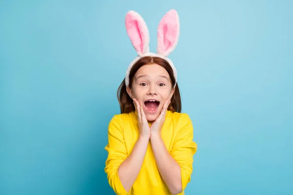 Close-up portrait of her she nice attractive lovely cute funny amazed cheerful cheery girl wearing rabbit ears having fun news reaction isolated over bright vivid shine vibrant blue color background — Stock Photo, Image