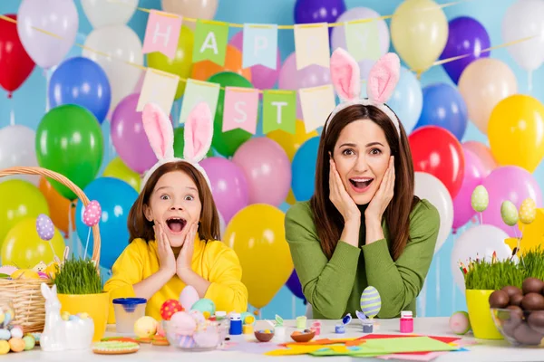 Portrait of nice attractive lovely pretty charming girlish cheerful cheery funny girls wearing bunny ears having fun making craftwork enjoying — Stock Photo, Image