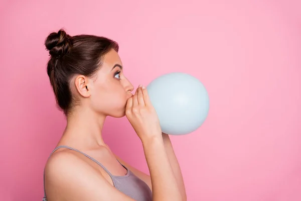 Profile side photo of astonished girl blowing small white air baloon look copy space impressed wear casual style clothes isolated over pink color background — Stock Photo, Image