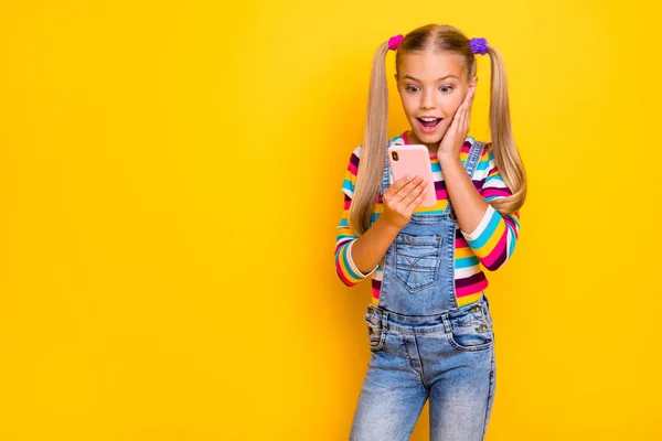 Omg new followers. Crazy energetic kid addicted blogger use smartphone read social media news impressed scream wear striped sweater jumper denim jeans isolated bright shine color background — Stok fotoğraf