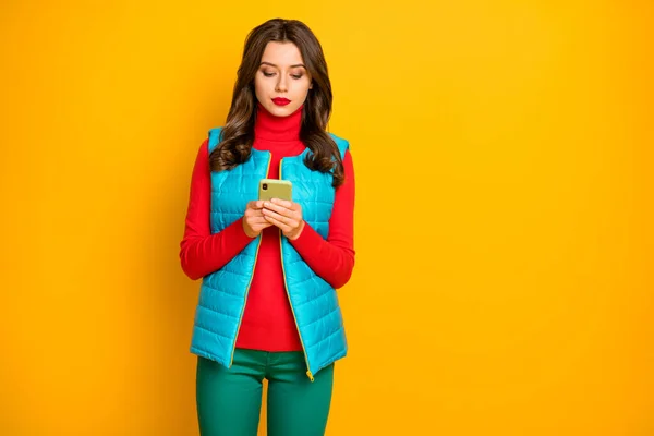 Portrait of serious focused girl use smart phone follow share repost social media information wear red green good look jumper isolated over bright color background — Stock Photo, Image