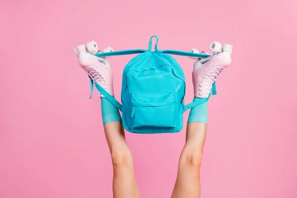 Cropped view of nice attractive long slender fit legs wearing blue comfortable socks skate rollers holding bag having fun isolated over pink pastel color background — Stock Photo, Image